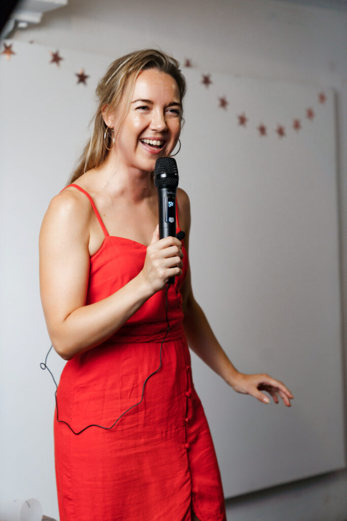 Mila Kopaeva performs in a red dress